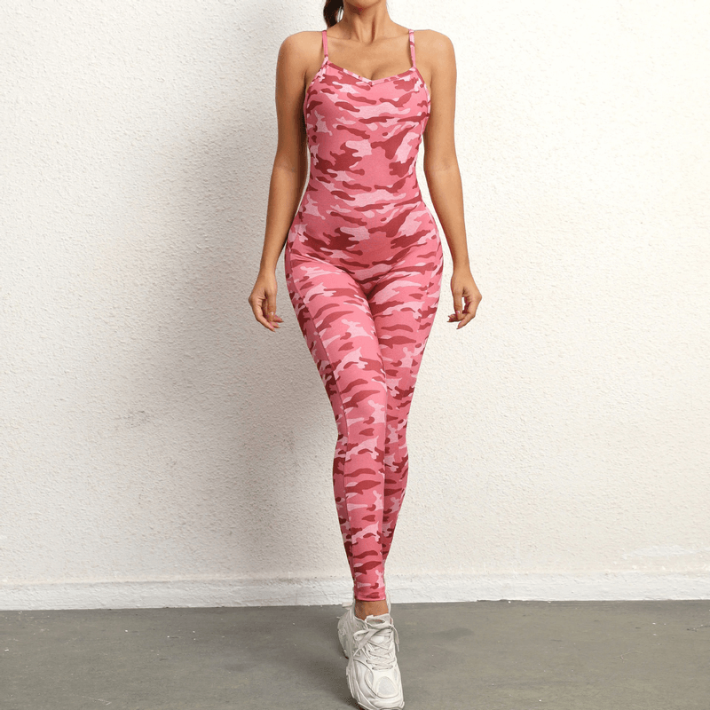 Pink camo seamless yoga jumpsuit with V-neck and open back, designed for comfort during workouts. Stylish and breathable fit.